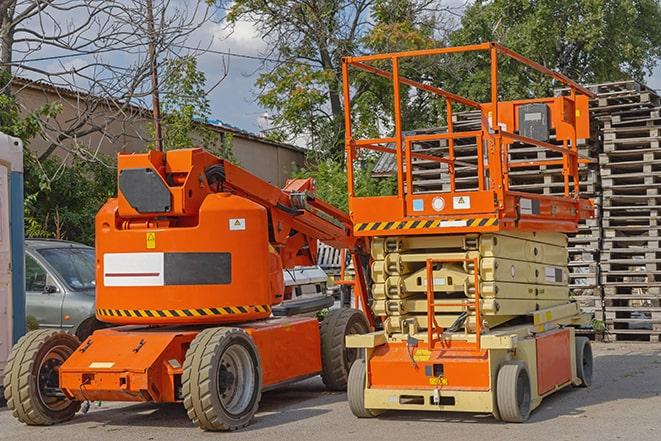 warehouse worker operating forklift to stack inventory in Green Valley